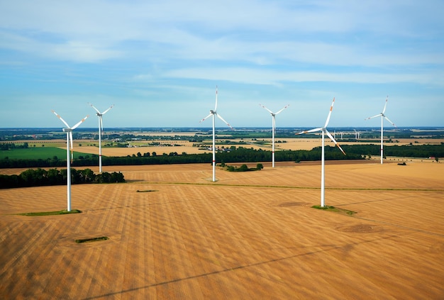 Windmills against sky