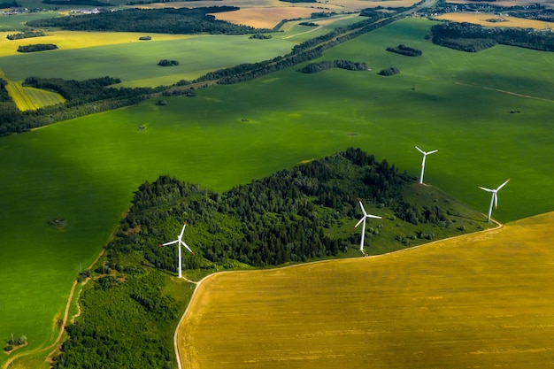 Windmills on the background of forests and fields