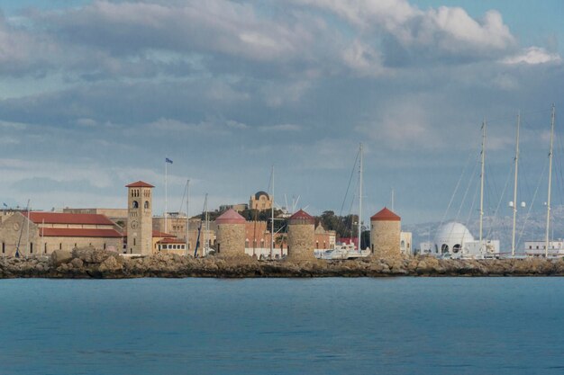 Windmills at mandraki harbour rhodes greece europe