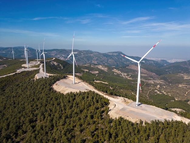 Windmills wind turbines on top of a mountain