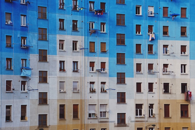 window on the blue building facade