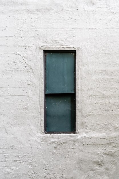 Window in concrete wall background