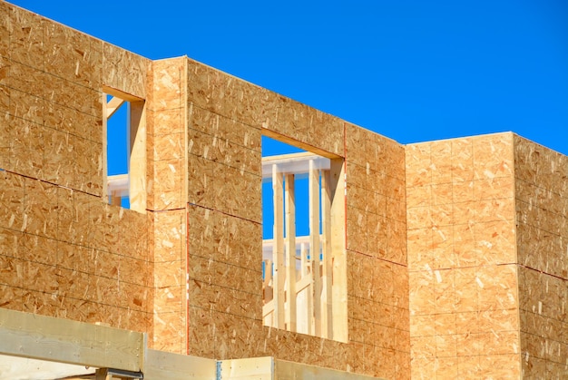 Window frame of new low rise building on blue sky background