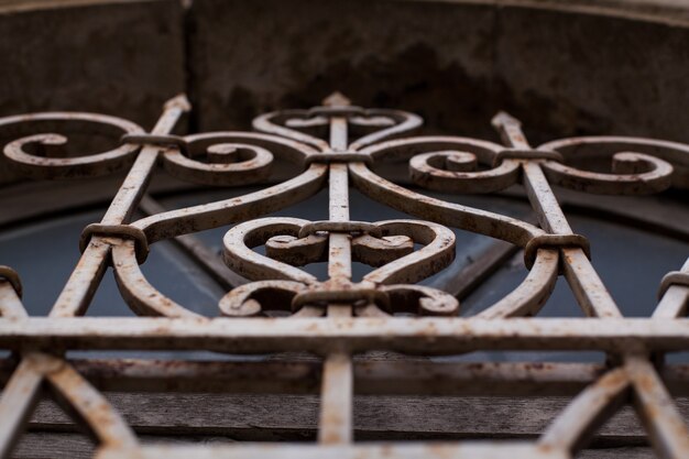 Window in an old building with rusty lattice