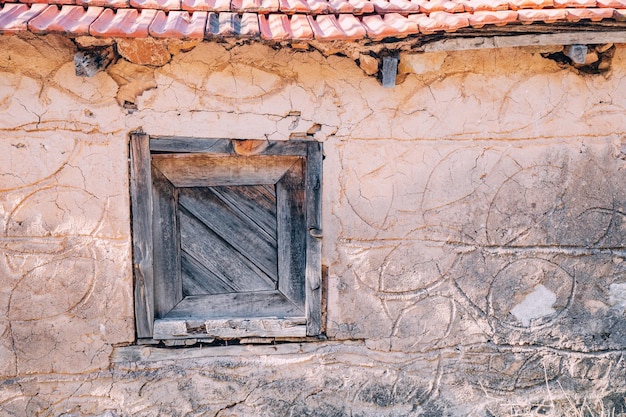 Window in the old stone house closeup