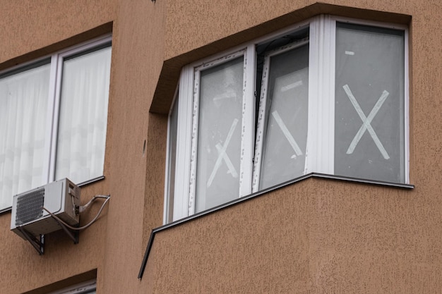 Window protection. Blast wave. Tape-taped windows. Rules of survival. War in Ukraine.