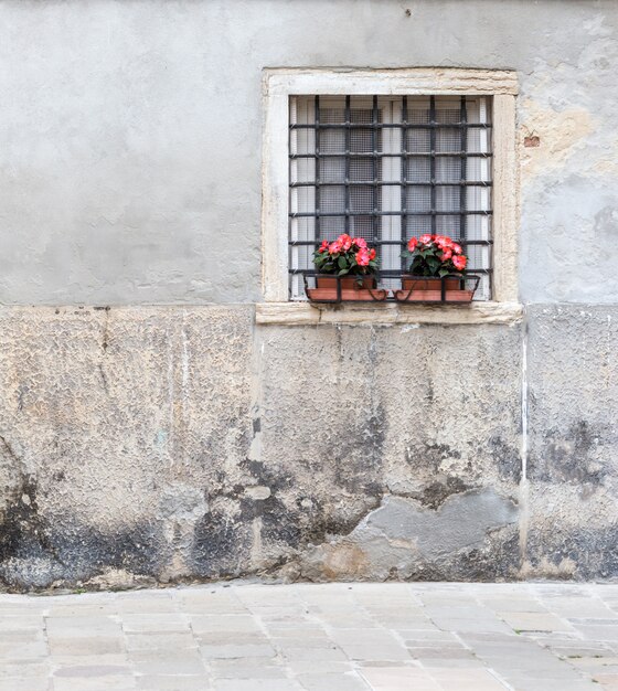 Window with bars in the old house in Venice Italy