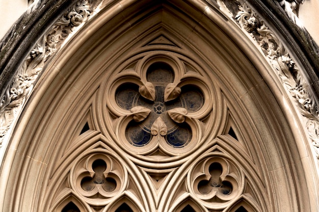 A window with a cross on it that has the word cathedral on it.