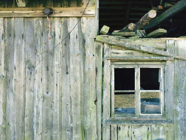 Photo window on wooden wall