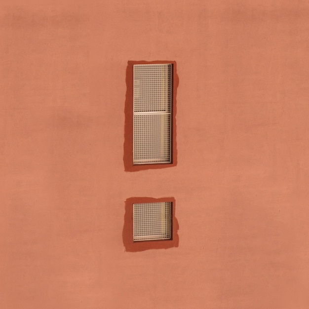 Windows on brown wall