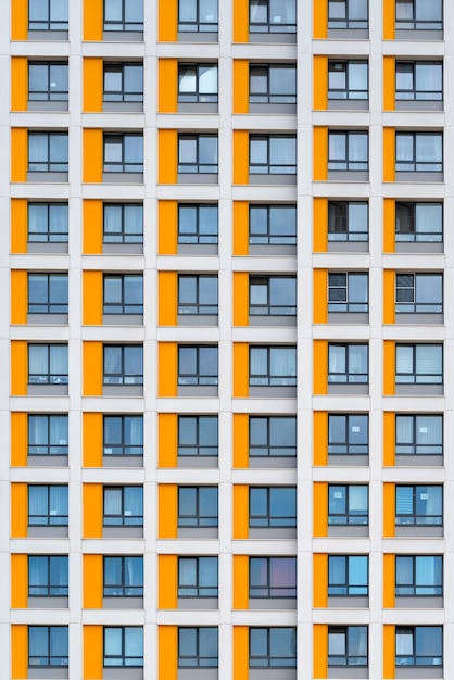 Windows of the facade of a modern building construction and\
rental housing