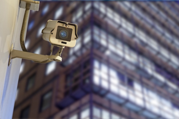 Windows of Skyscraper Business Office, Corporate building in London City, England, UKSecurity, CCTV camera for office building at night