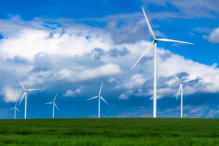 Foto windturbines op een groen veld met een blauwe lucht op de achtergrond