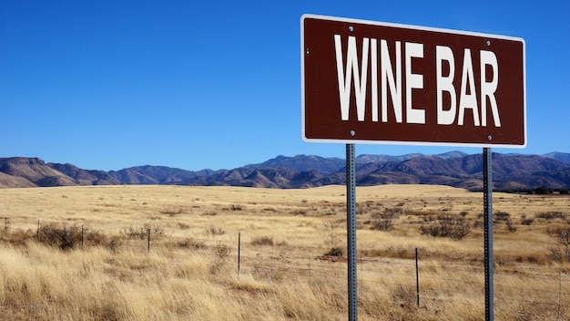 Wine bar word on road sign