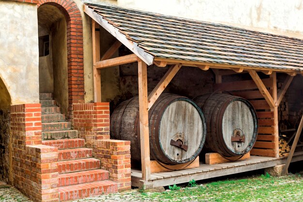 Wine barrels under a canopy