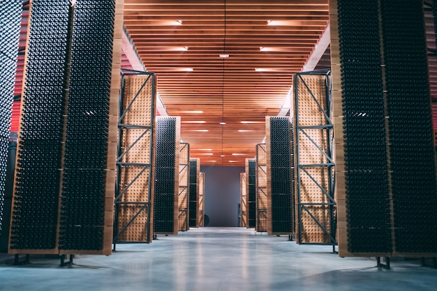 Photo wine barrels stored in a winery on the fermentation process