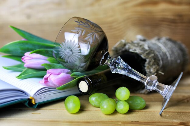 Wine bottle book and glass grape