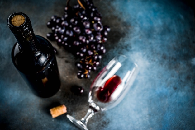 Wine bottle with glass and grapes 