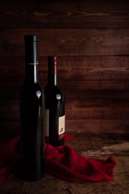 wine bottles on dark wooden background