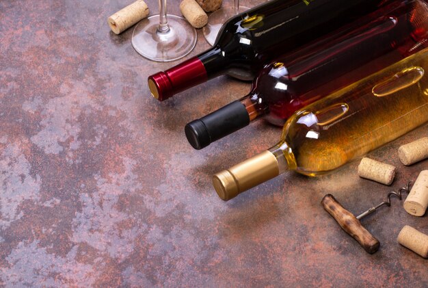 Wine bottles and glass on table