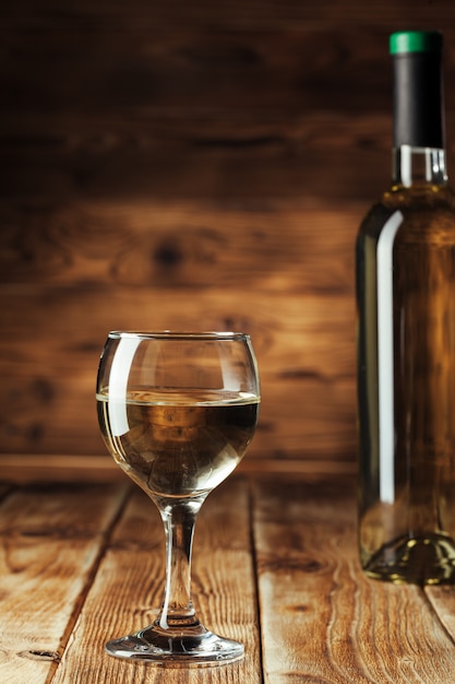 Wine bottles with glass,  wood