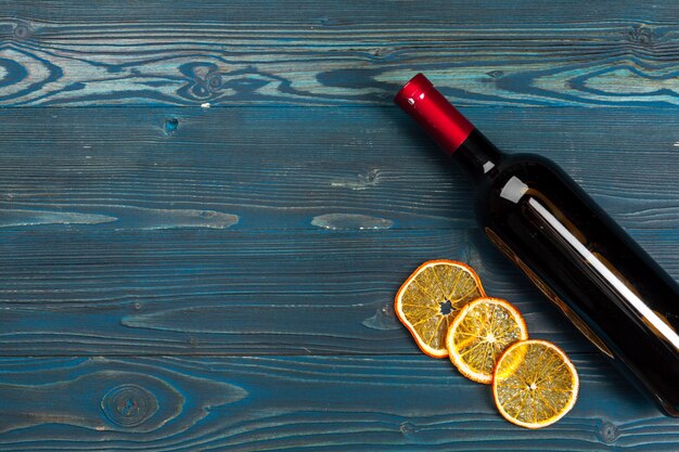 Wine bottles on wooden background, close up