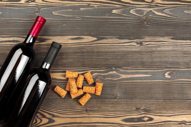 Wine bottles on wooden background, close up