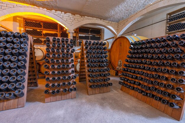 Wine cellar with barrels and bottles