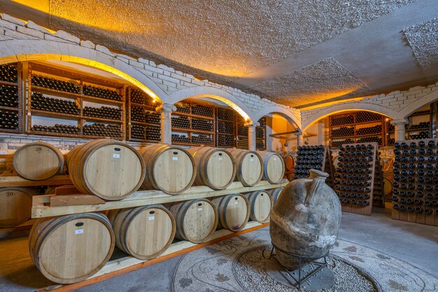 Wine cellar with barrels and bottles