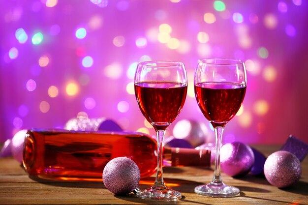 Wine and Christmas decoration on bright background