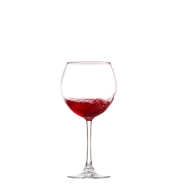 Wine collection Splashing red wine in a glass Isolated on white background