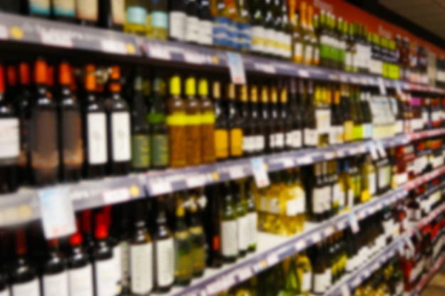 Wine department in supermarket blurred background