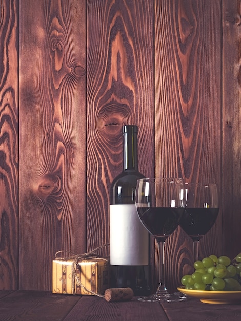 Wine and gifts on wooden table