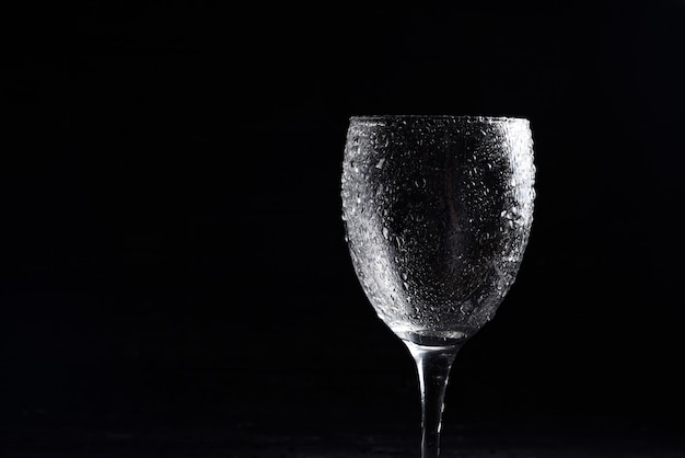 https://img.freepik.com/premium-photo/wine-glass-black-white-black-surface-with-water-drops_283727-20.jpg?size=626&ext=jpg