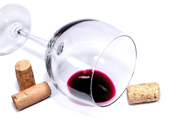 Wine glass and corks isolated