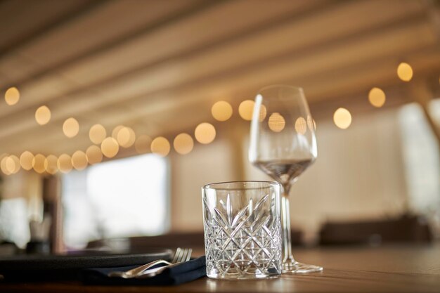 A wine glass on a light background in a warm key