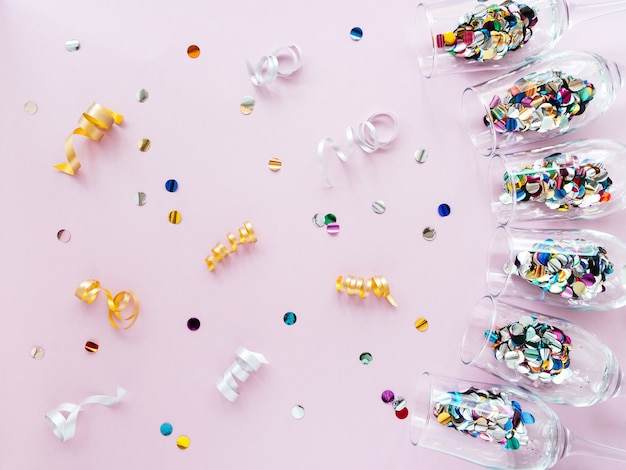 Wine glasses filled with confetti like champagne