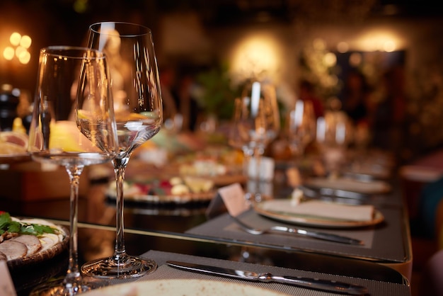 Wine glasses in warm light loft restaurant