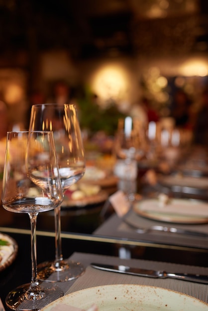 Wine glasses in warm light loft restaurant