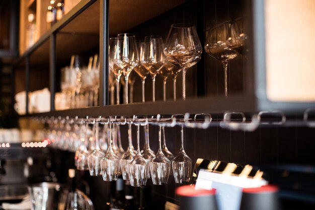 Wine glasses in warm light loft restaurant