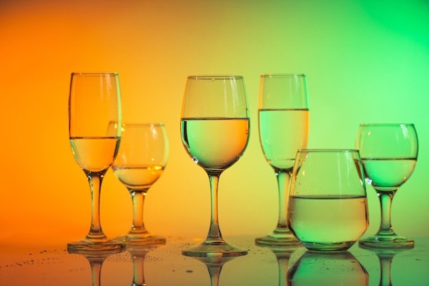 Wine glasses with neon multicolor light