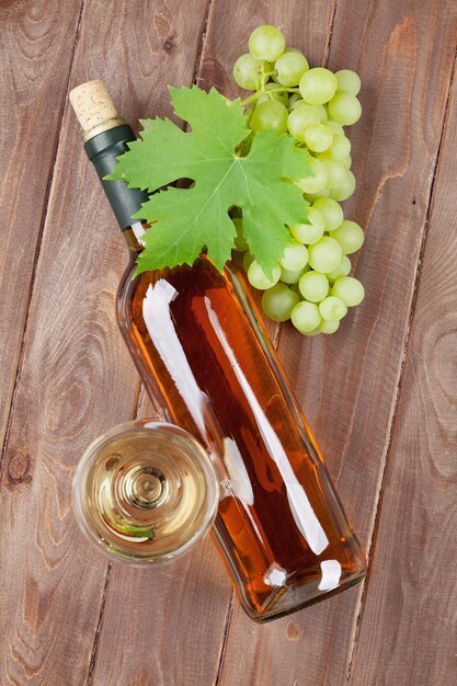 Wine and grape on garden table