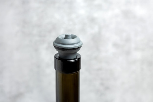 wine opener accessories toolsrose bottle and brie camembert cheese isolated gray tiles backgroundg