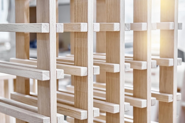 Wine rack made of solid oak and plywood during production in the workshop extreme closeup