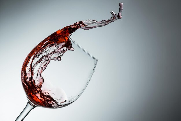 Wine splashes out of the glass