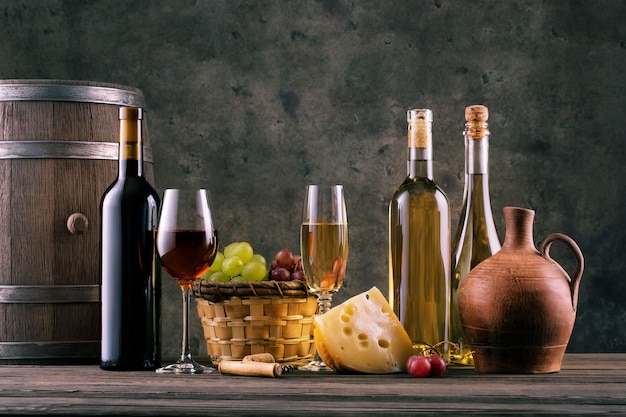 Wine still life with glasses of bottles and grapes