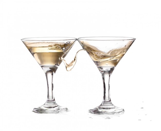 wine swirling in two goblet martini glass