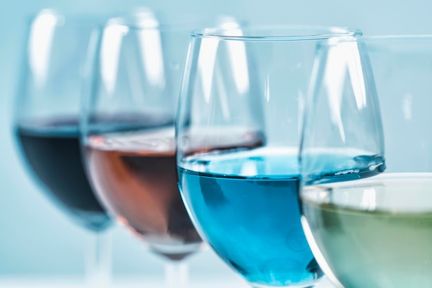 Wine varieties four glasses of wine on table red wine rose white and blue wine