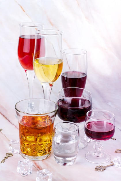 Wine variety. Goblets with red and white whine, vodka and cognac