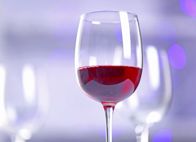 Wineglasses on blurred lights background